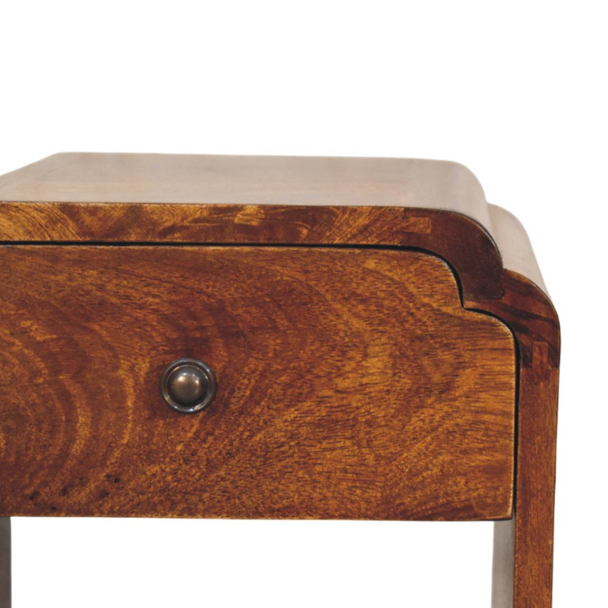 Close-up of the nightstand’s wood-grain drawer front, round knob, and curved upper edges.