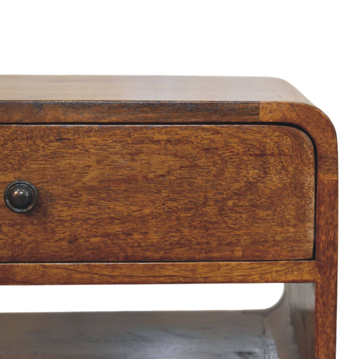 Close-up of the wood-grain drawer front, dark round knob, and rounded tabletop edge.