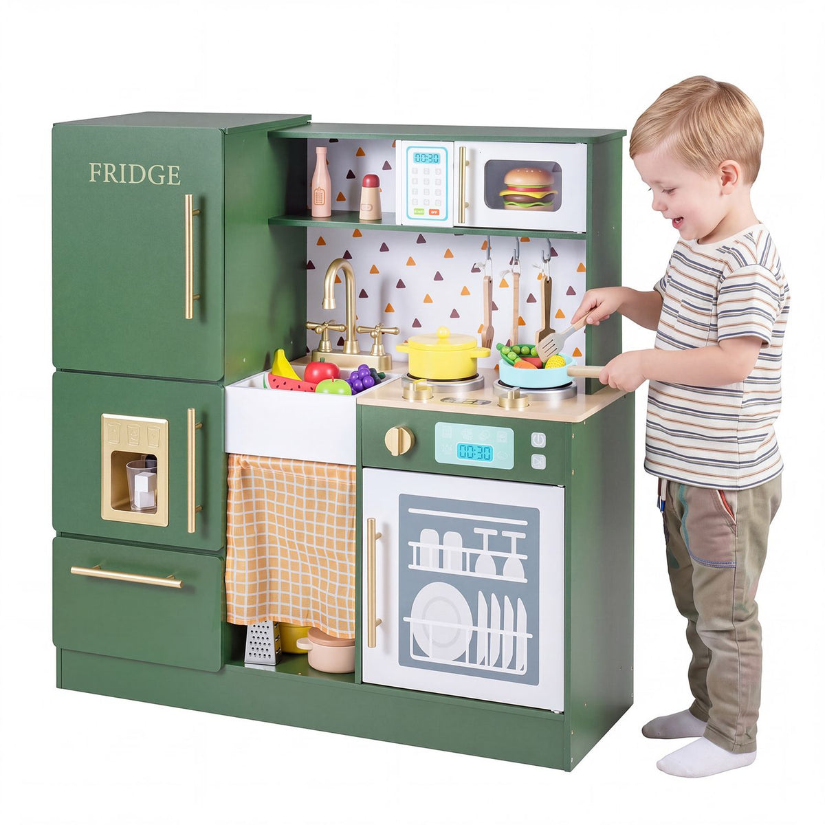 A child pretends to cook at the green play kitchen, stirring a pan beside the dishwasher.