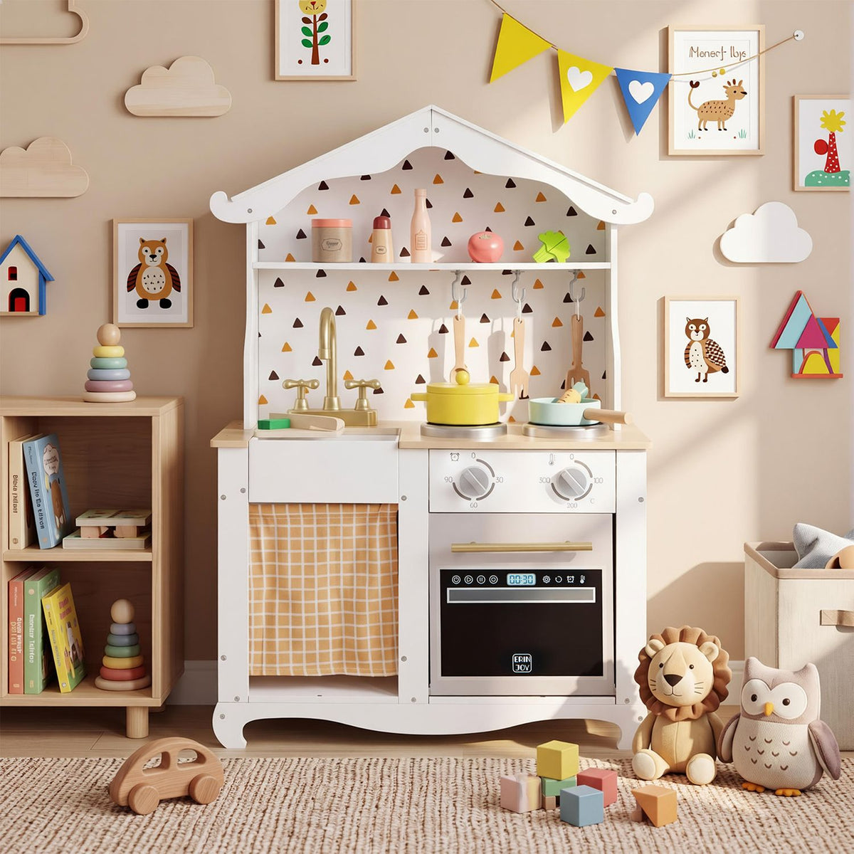 White play kitchen with toy cookware, set in a bright nursery beside plush animals and colorful blocks.