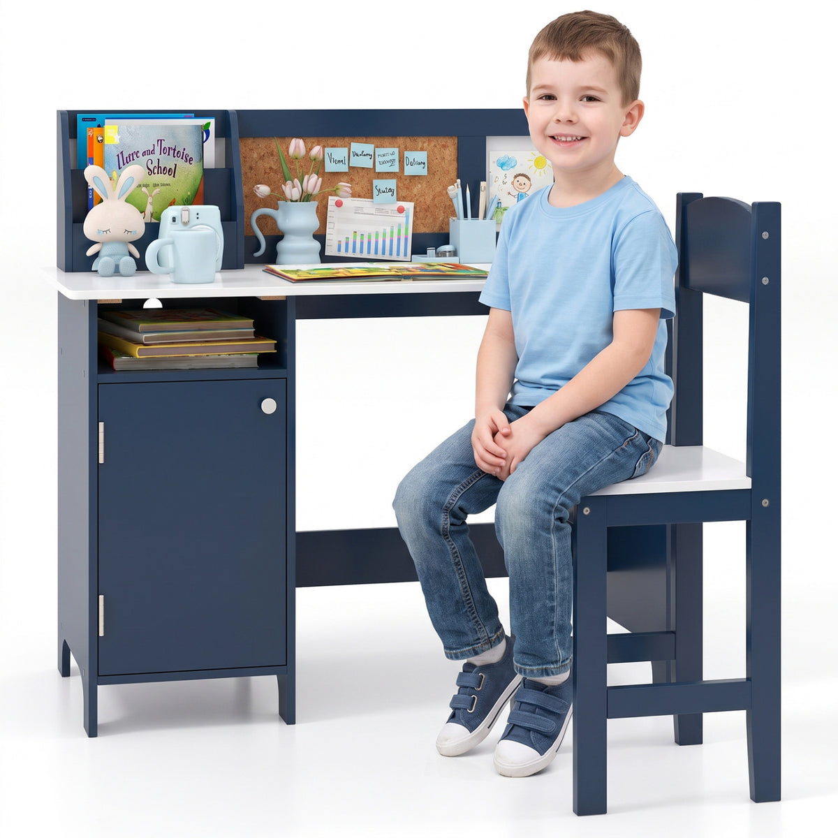Smiling child sitting on the matching chair beside the navy desk.