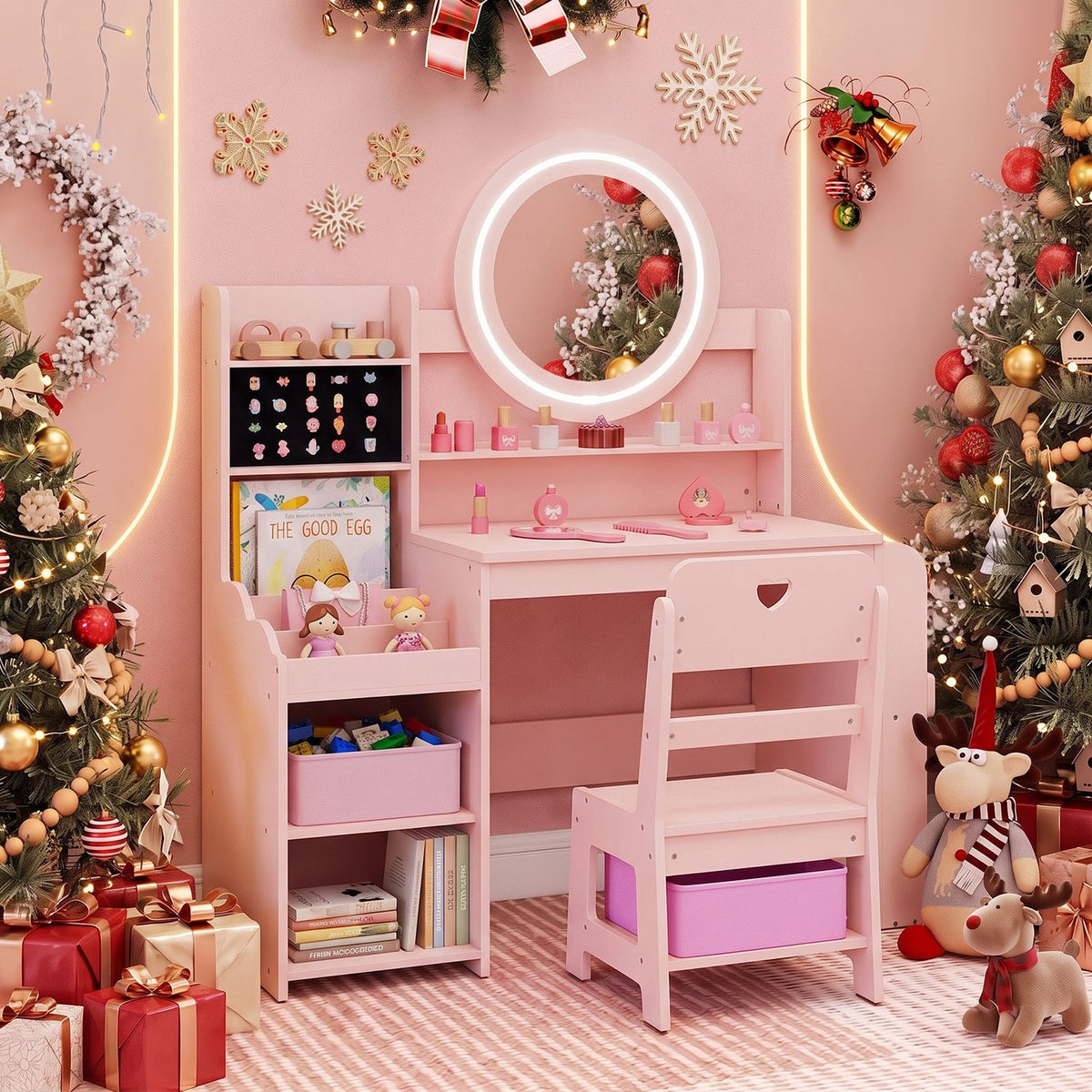 Pink vanity and chair arranged in a festive room with a glowing mirror and Christmas decorations.