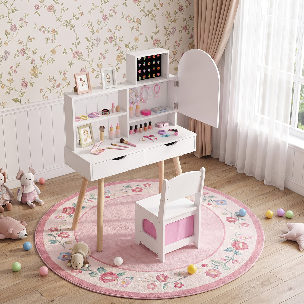 Vanity and matching chair arranged on a round pink rug in a bright floral-wallpapered room.