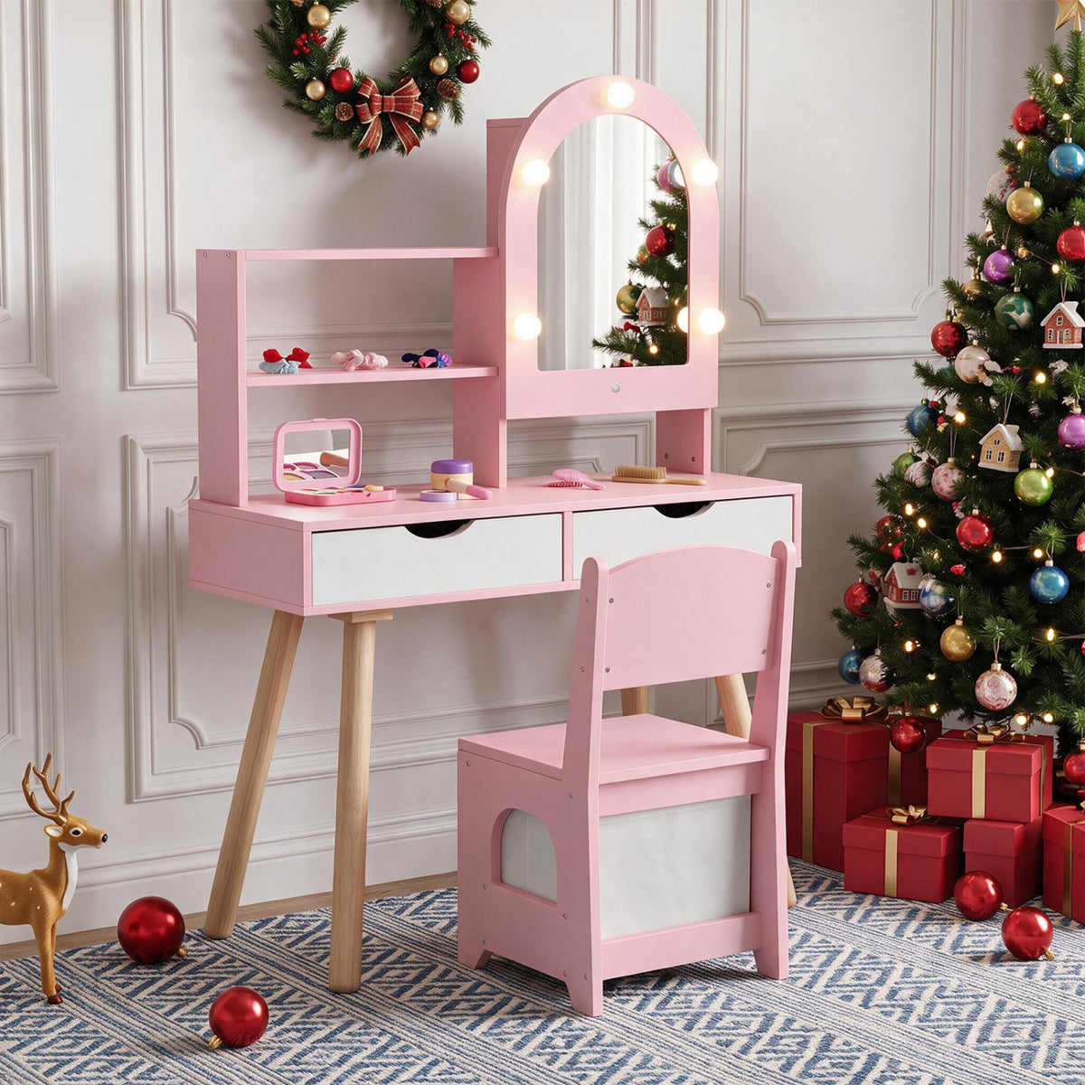 Pink vanity with illuminated mirror, shelves, and matching chair in a Christmas-decorated room.
