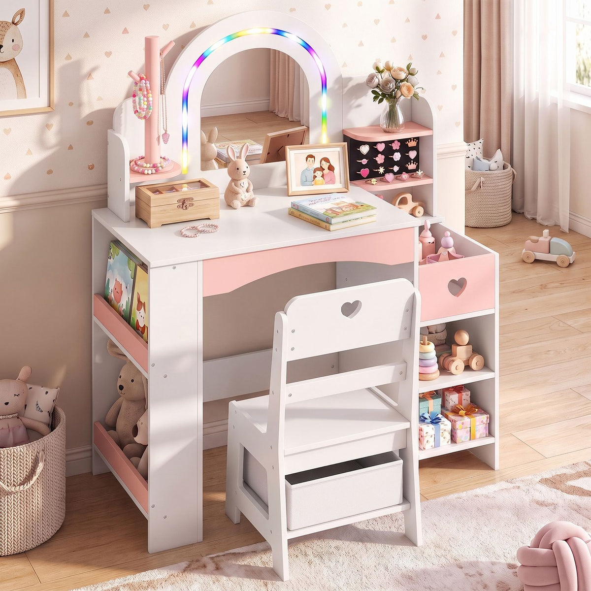 White and pink children's vanity with an illuminated arched mirror, chair, and toy-filled shelves in a nursery.