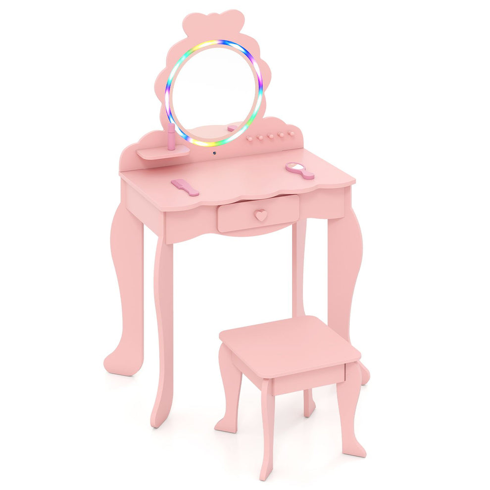 Pink children’s vanity with a round rainbow-lit mirror, small drawer, accessories, and matching stool.