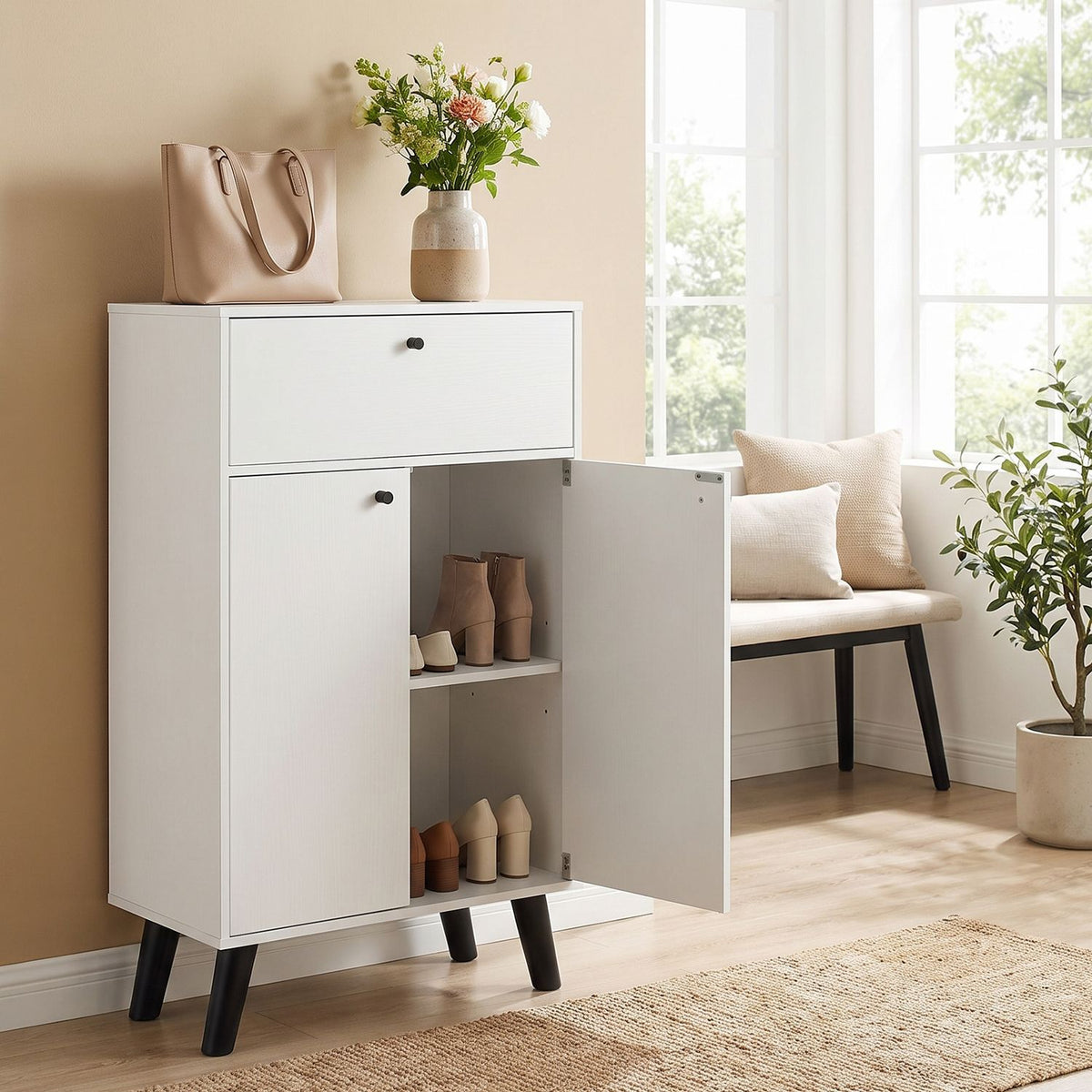 White cabinet with one door open and shoes on its shelves, beside a bright window and bench.