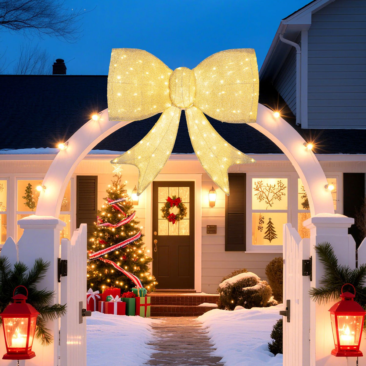 Illuminated golden bow displayed on an arch above a snowy front path and decorated house entrance.