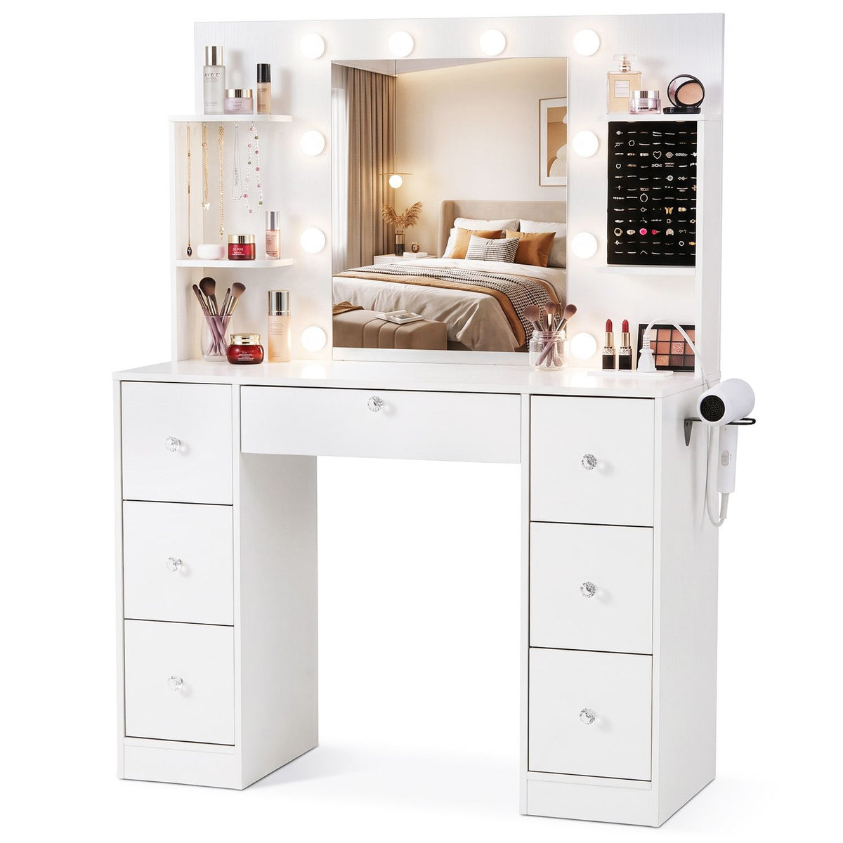 White vanity with illuminated mirror, display shelves, makeup organizers, and a hair dryer mounted at the side.