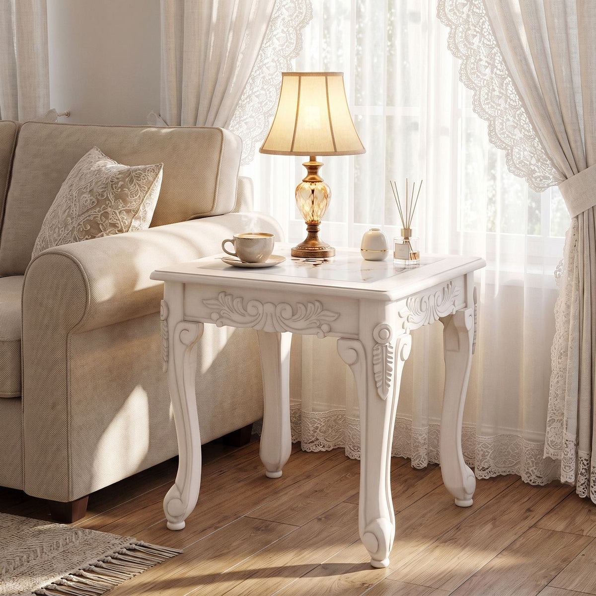 White carved coffee table beside a sofa in a bright living room