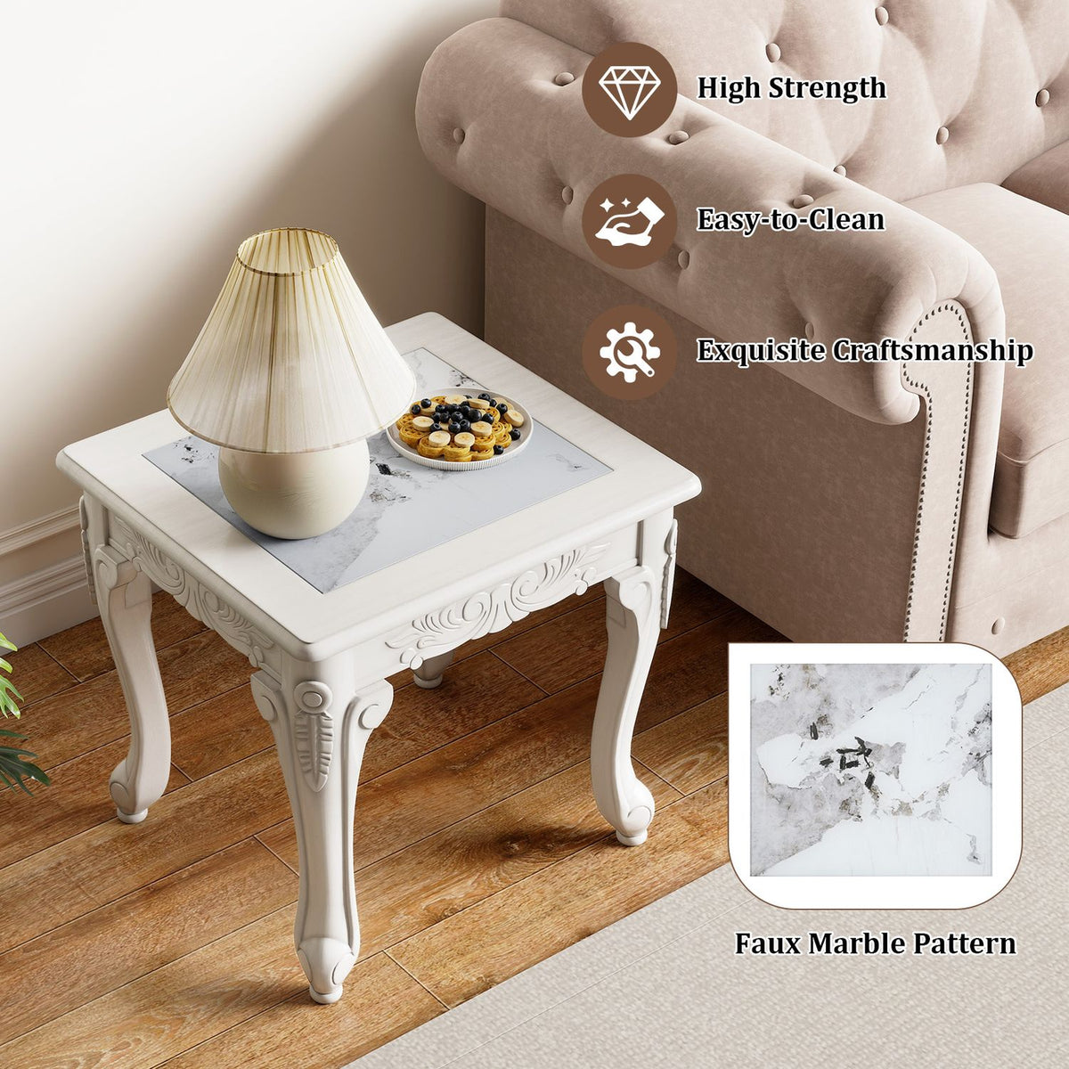 White carved-leg coffee table with a pale marble-patterned top beside a blush tufted sofa; inset shows the tabletop pattern.