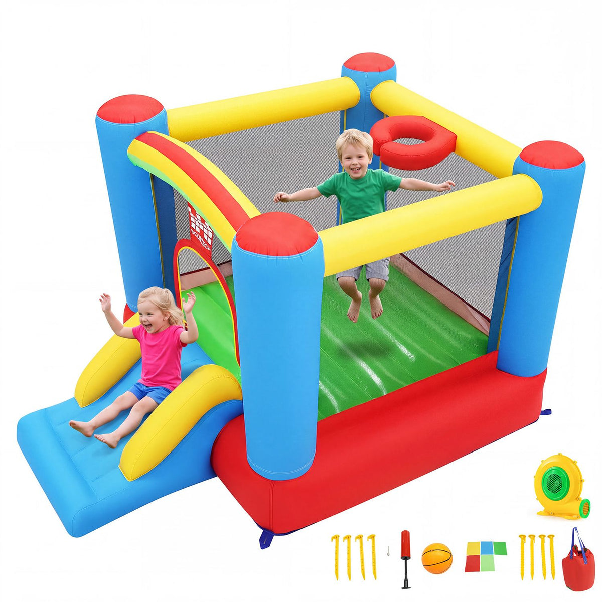 Two children play inside the bounce house, with the slide and accessories shown around it.