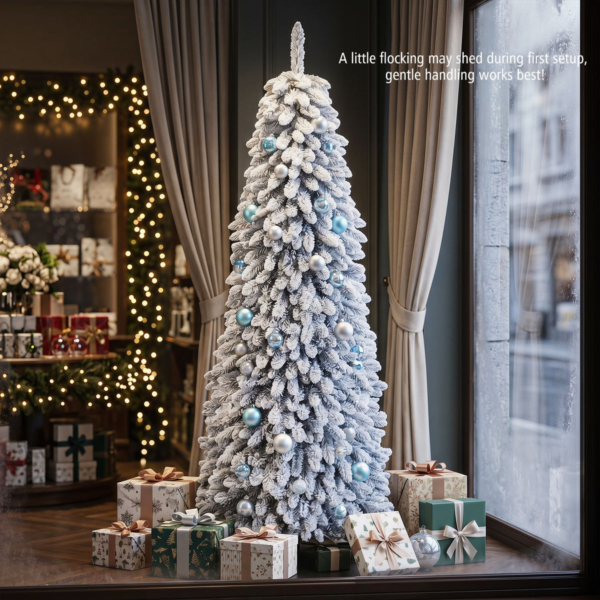 Snowy, ornamented Christmas tree displayed by a window, surrounded by presents in a warmly lit room.