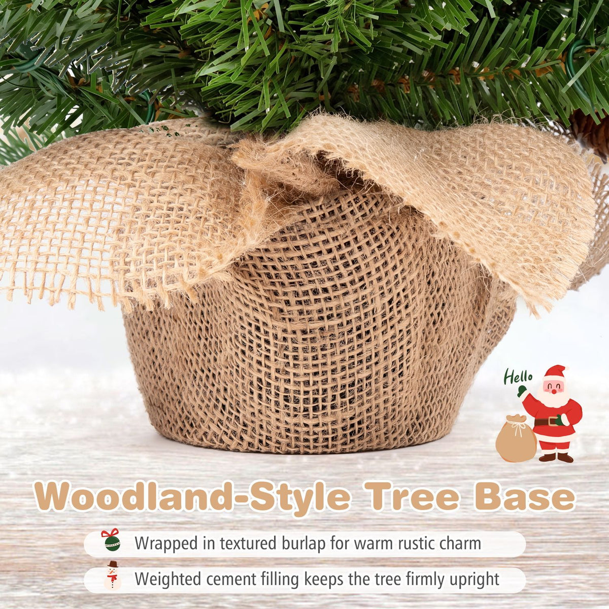 The lower branches of a mini tree sit above a burlap-wrapped base on a light surface.