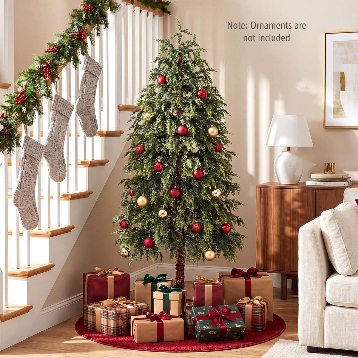 Decorated green Christmas tree with ornaments and wrapped gifts in a living room