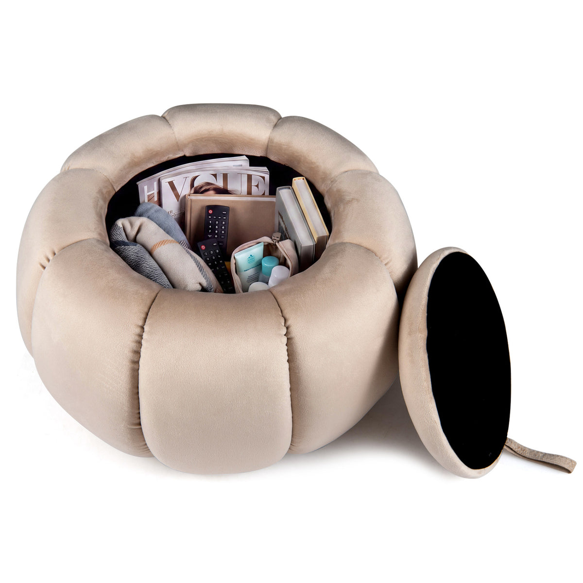 Ottoman with its lid removed, revealing stored books, fabric, and small items inside.