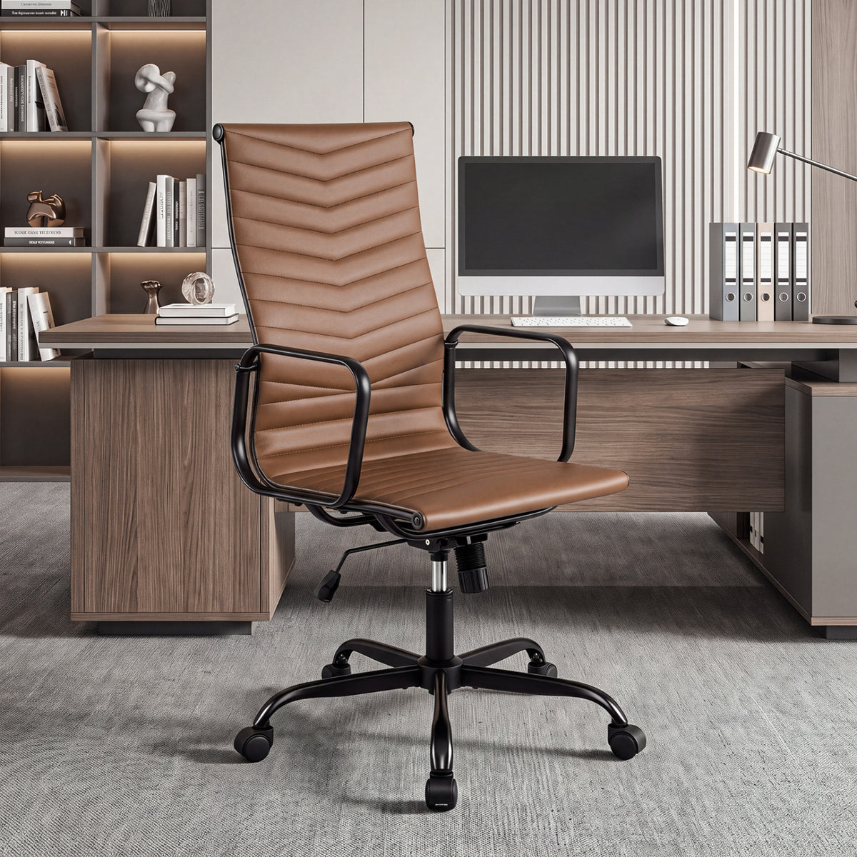 Brown ribbed office chair with curved armrests in a modern office with a large desk.