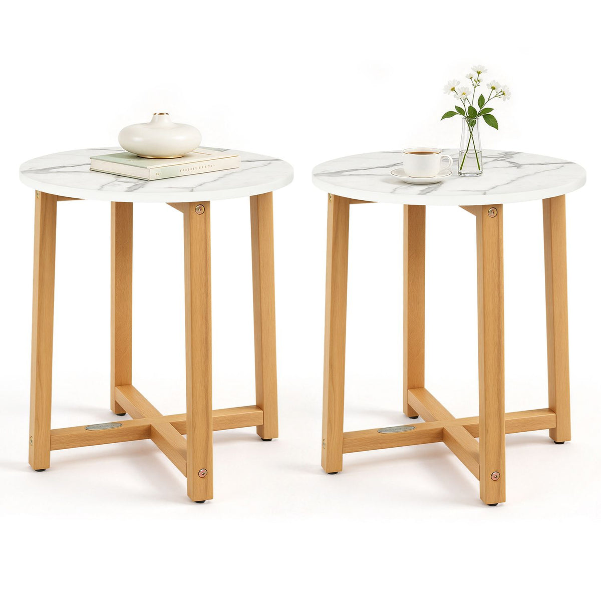 Two round tables with white veined tops and light wood legs against a white background.
