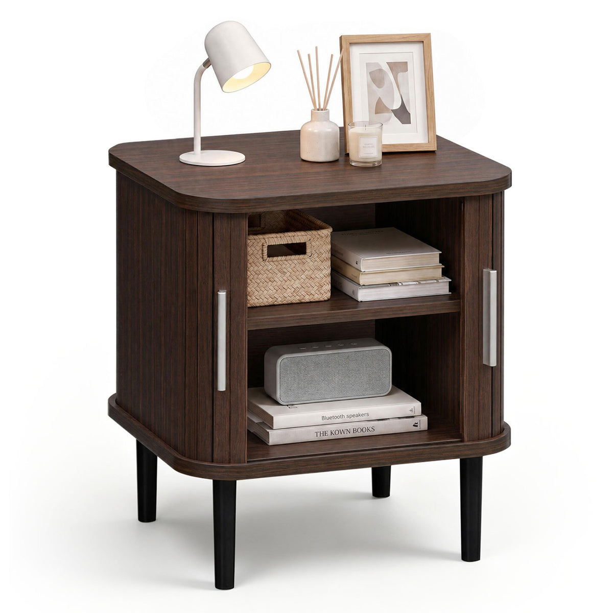Dark fluted nightstand with sliding doors open, showing two shelves holding books and woven storage baskets.