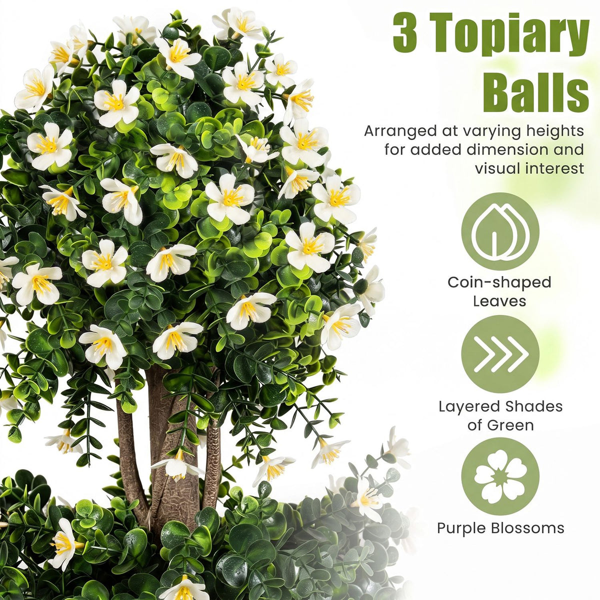 Close-up of green topiary foliage with white flowers and three layered foliage balls