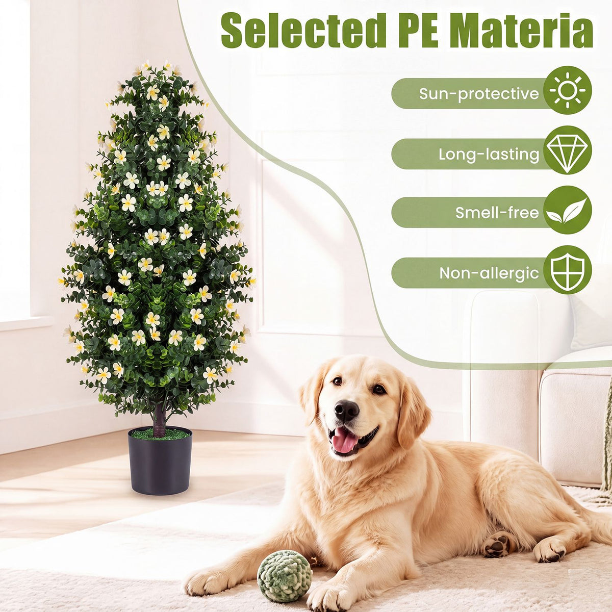 White-blossomed topiary in a dark planter beside a dog resting on the floor.