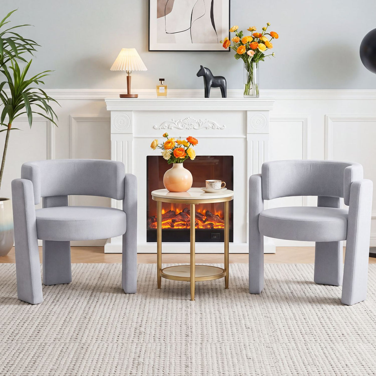 Pair of light gray barrel accent chairs facing forward in a living room