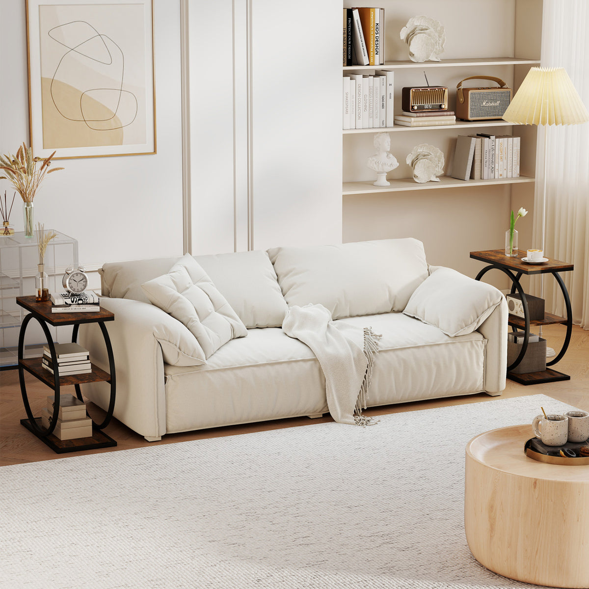 Two dark wood-look side tables with black metal frames flank a cream sofa in a bright living room.