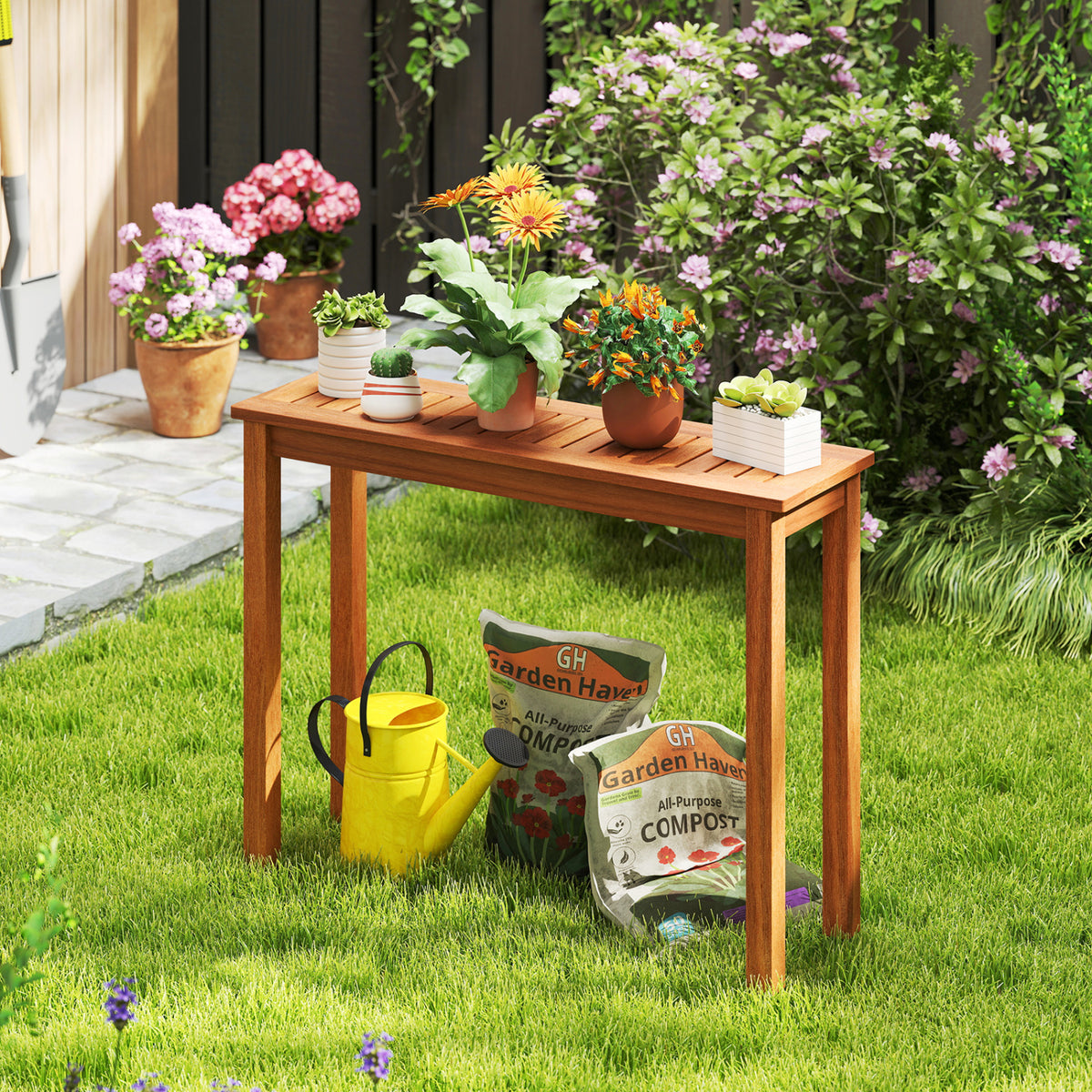 A wooden plant stand holding potted flowers in a garden, with watering and compost supplies beneath it.
