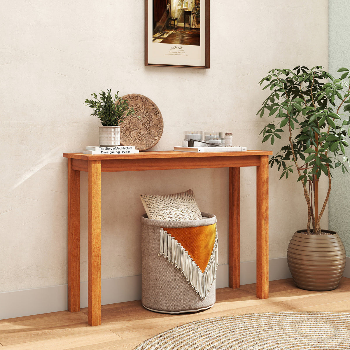 Wooden plant stand styled as a console table with books and decor, beside a potted tree.