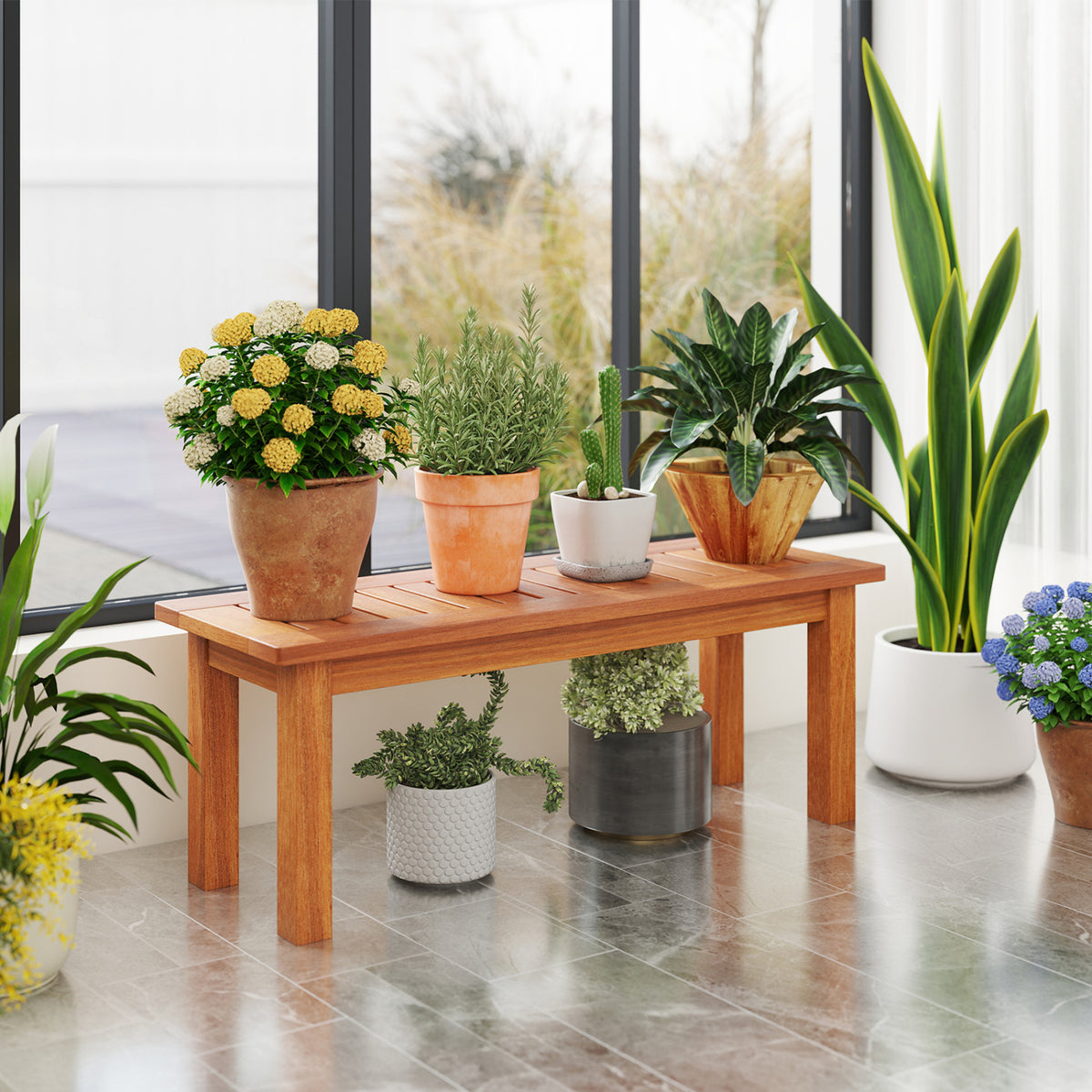 Wooden slatted plant stand holding potted plants by a large window, with more plants arranged below and around it.