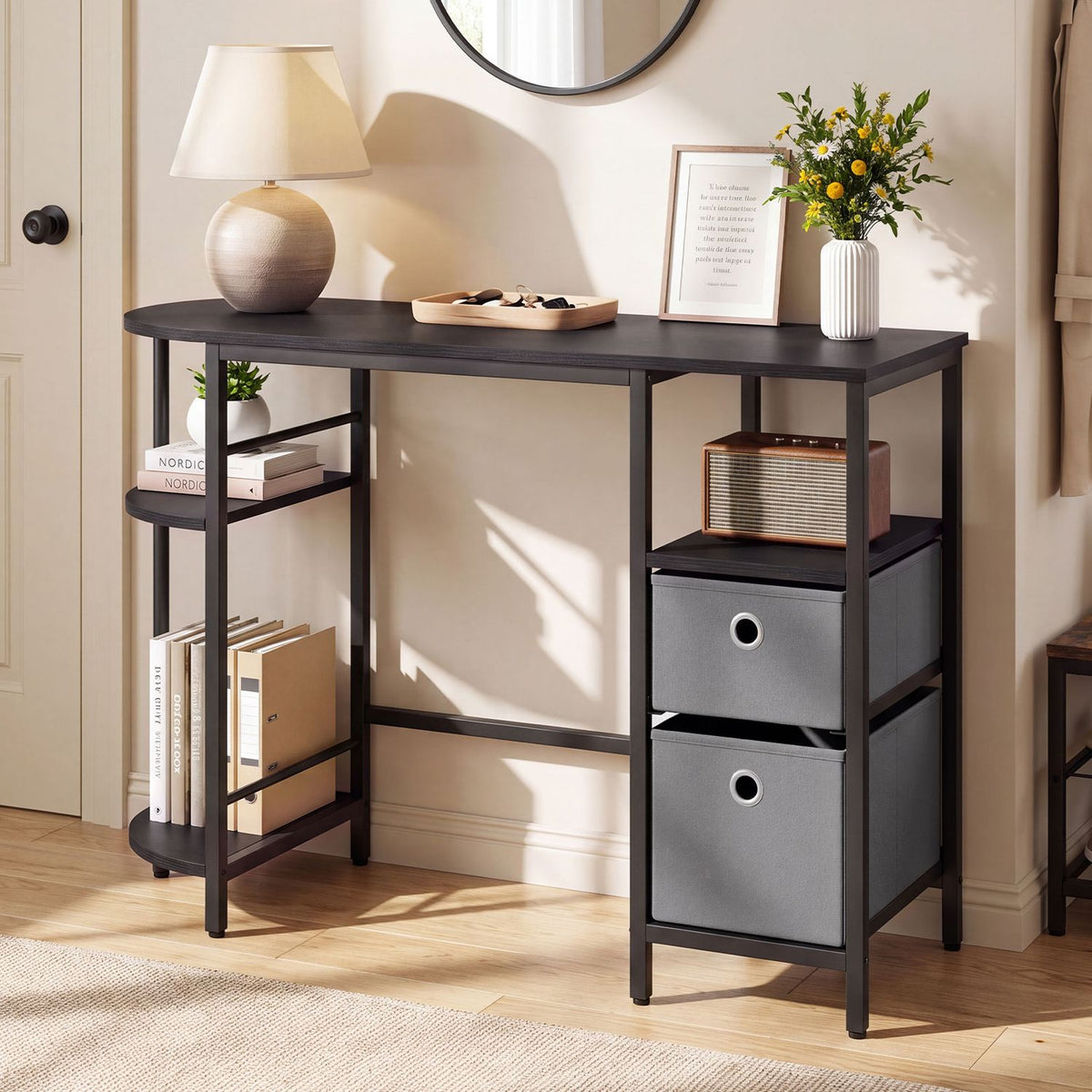 Dark desk with a rounded two-tier side shelf and two fabric drawers, styled with books and decor.