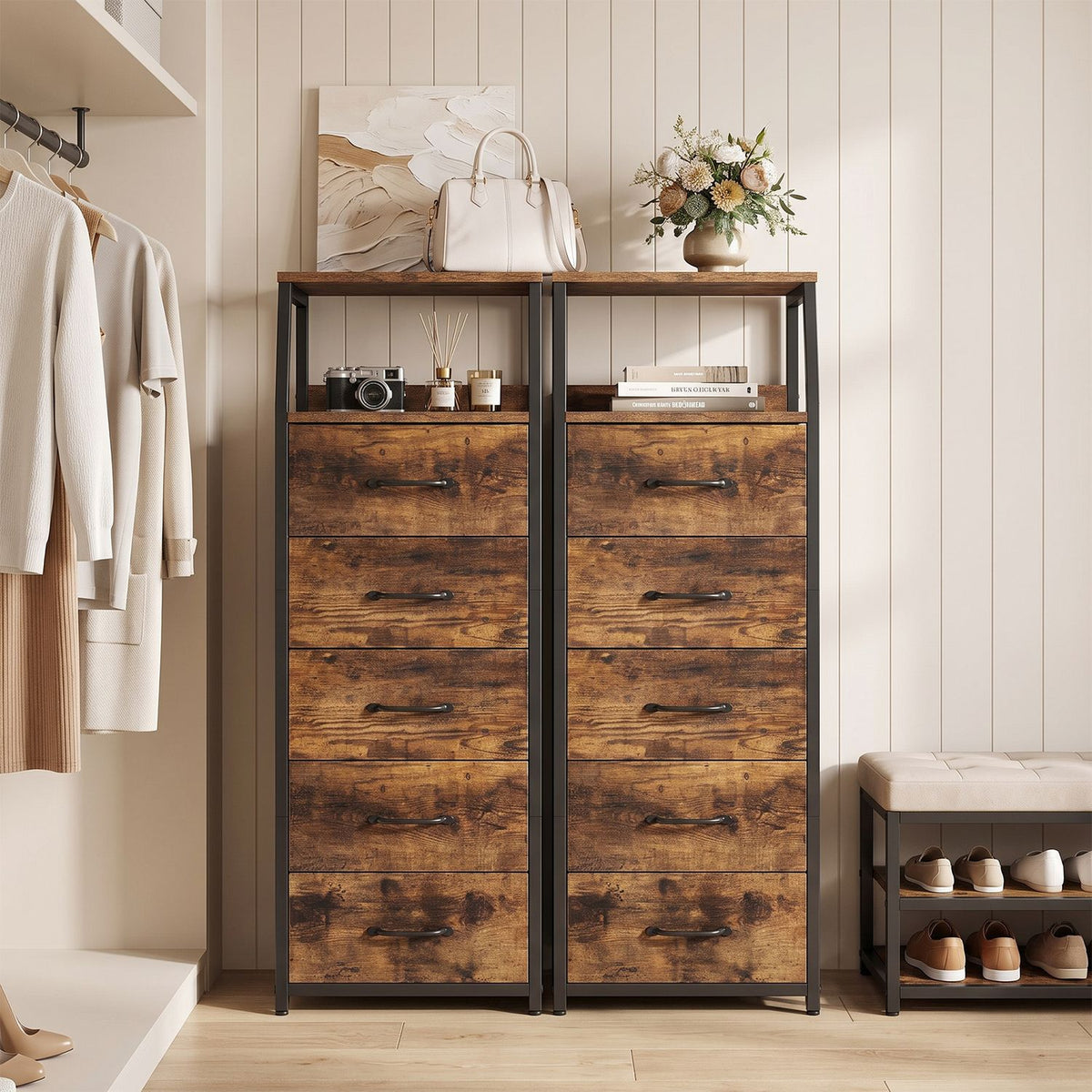 Two rustic brown tall dressers with open shelves and five drawers each in a bedroom