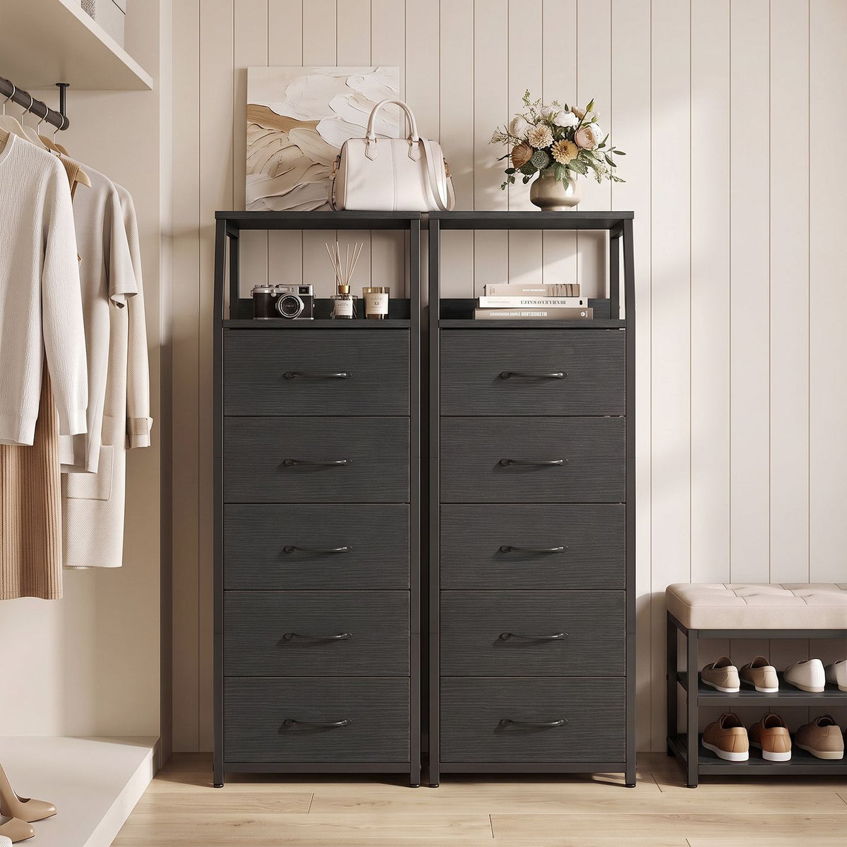 Two charcoal dressers with open shelves stand side by side in a light dressing room.