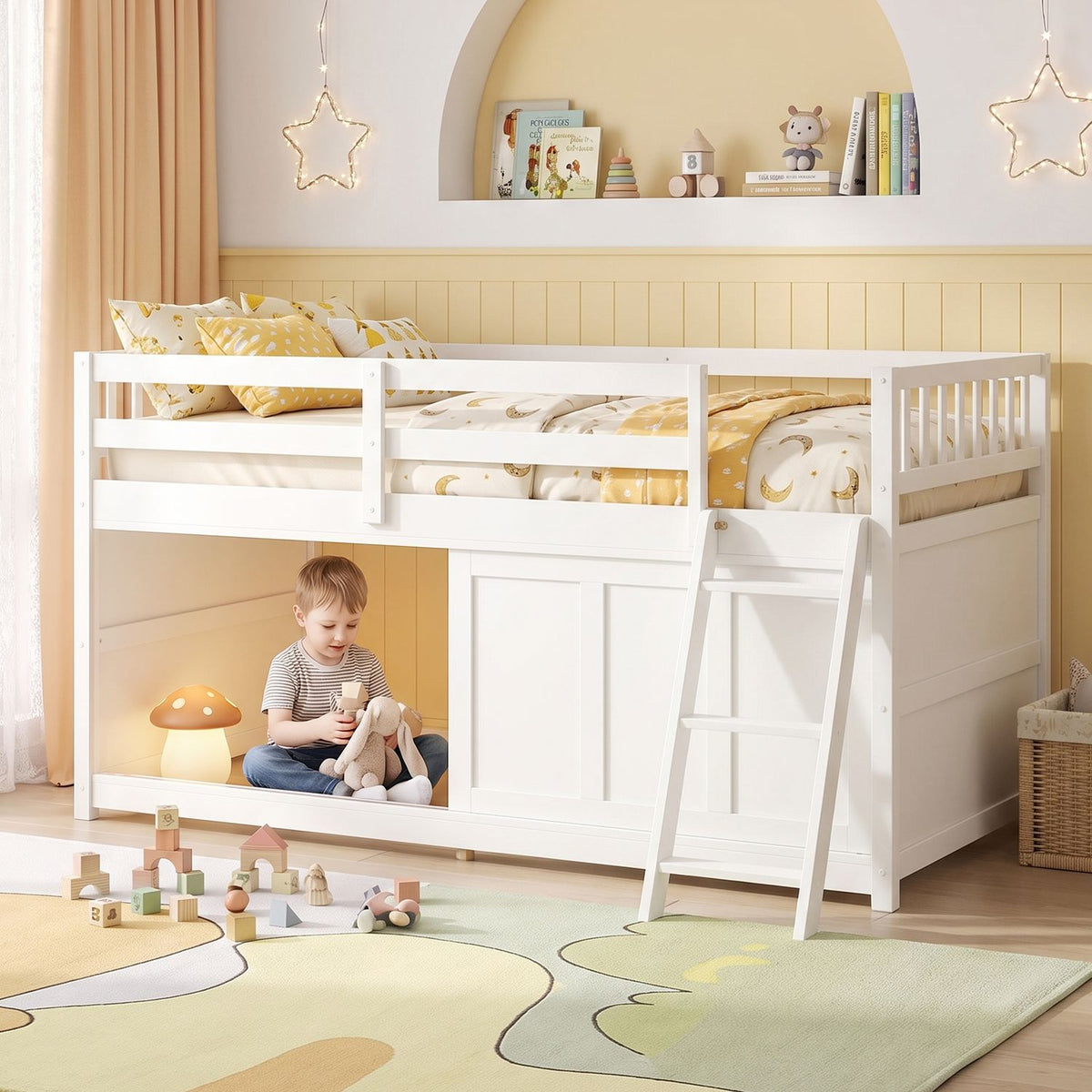 White loft bed with yellow bedding, a ladder, and a child playing in the space beneath it.