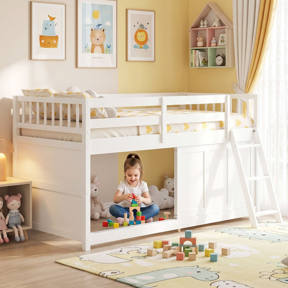 White loft bed shown from the side in a bright children’s room, with a child playing underneath.