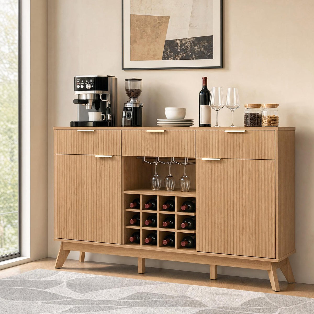 Fluted wood bar cabinet with wine bottles and hanging glasses in a bright living space.