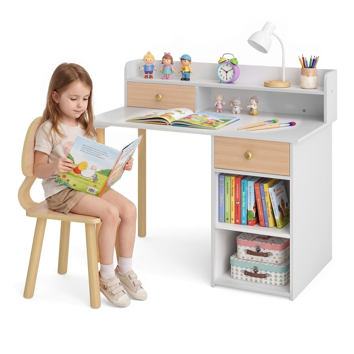 A child reads beside a white desk with natural wood-tone drawers and a matching chair.