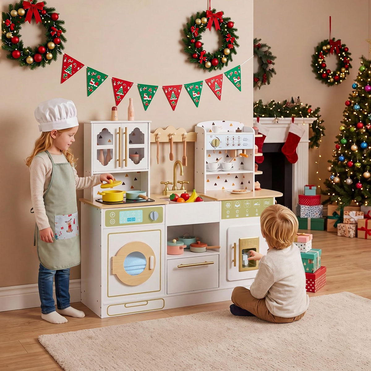 Two children play with a white toy kitchen beneath festive holiday decorations.