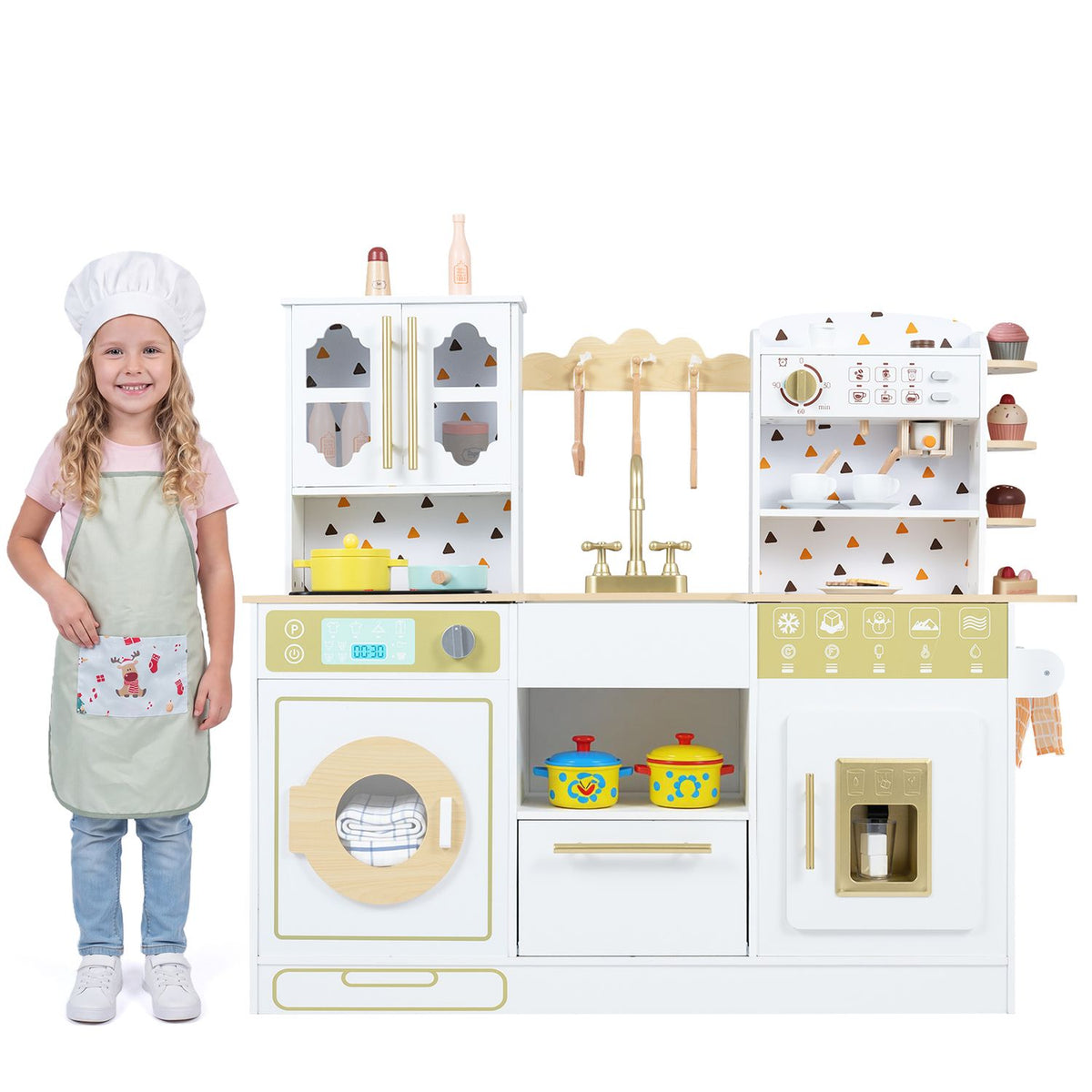 A child stands beside the toy kitchen, with colorful pots displayed in its open center compartment.