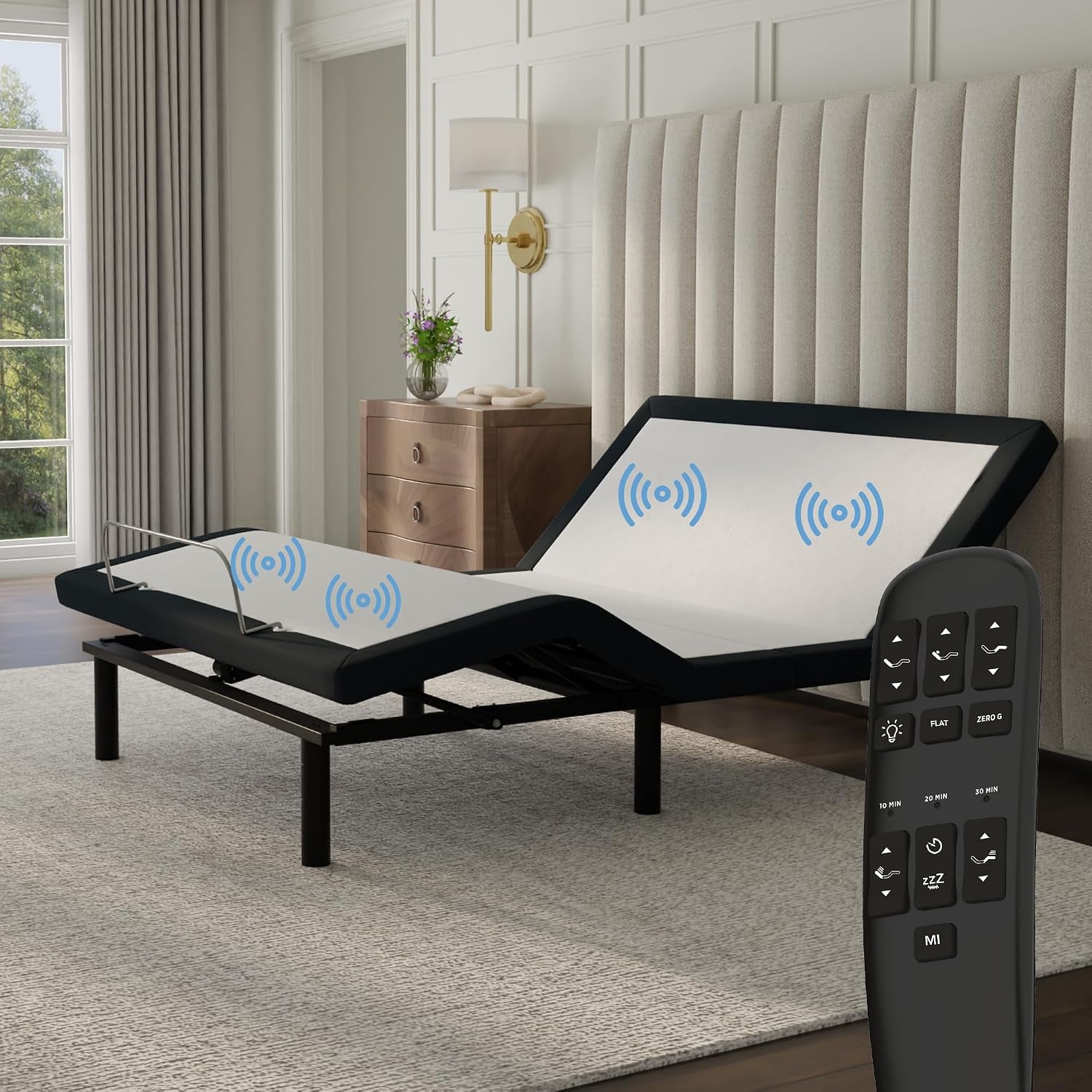 Angled shot of adjustable base raised at head with bedside table and remote in foreground