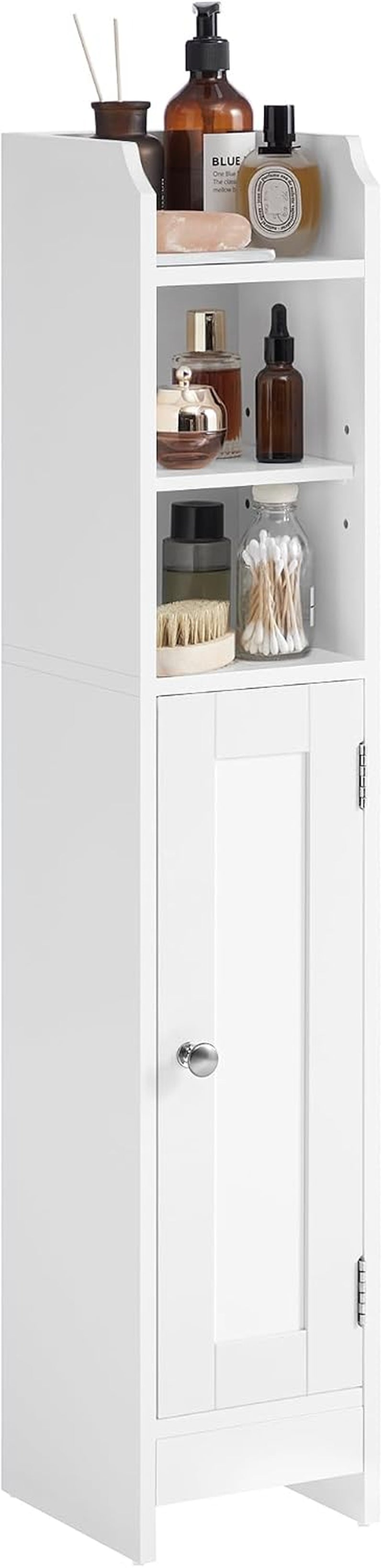 Tall slim white cabinet showing two open shelves filled with bottles above a single hinged door
