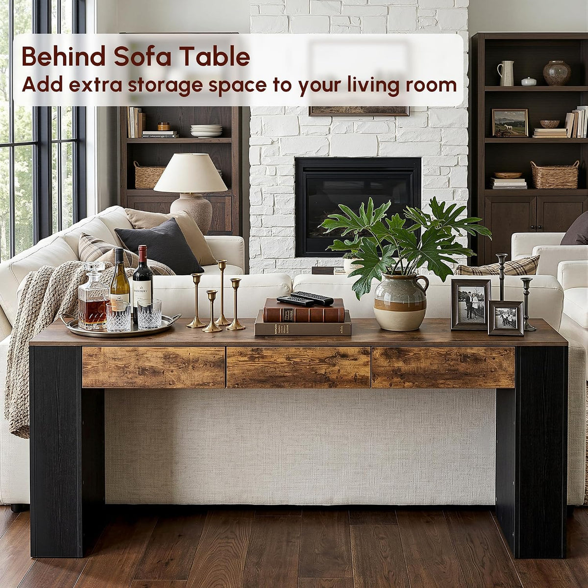 Console table placed behind a light sofa as a behind-sofa table with decorative accessories and books