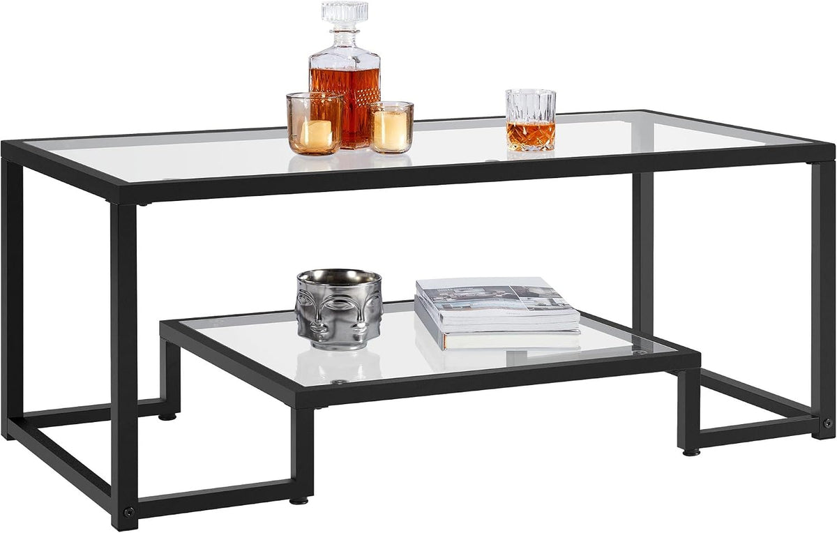 Black metal-framed rectangular glass coffee table with lower glass shelf on white background.
