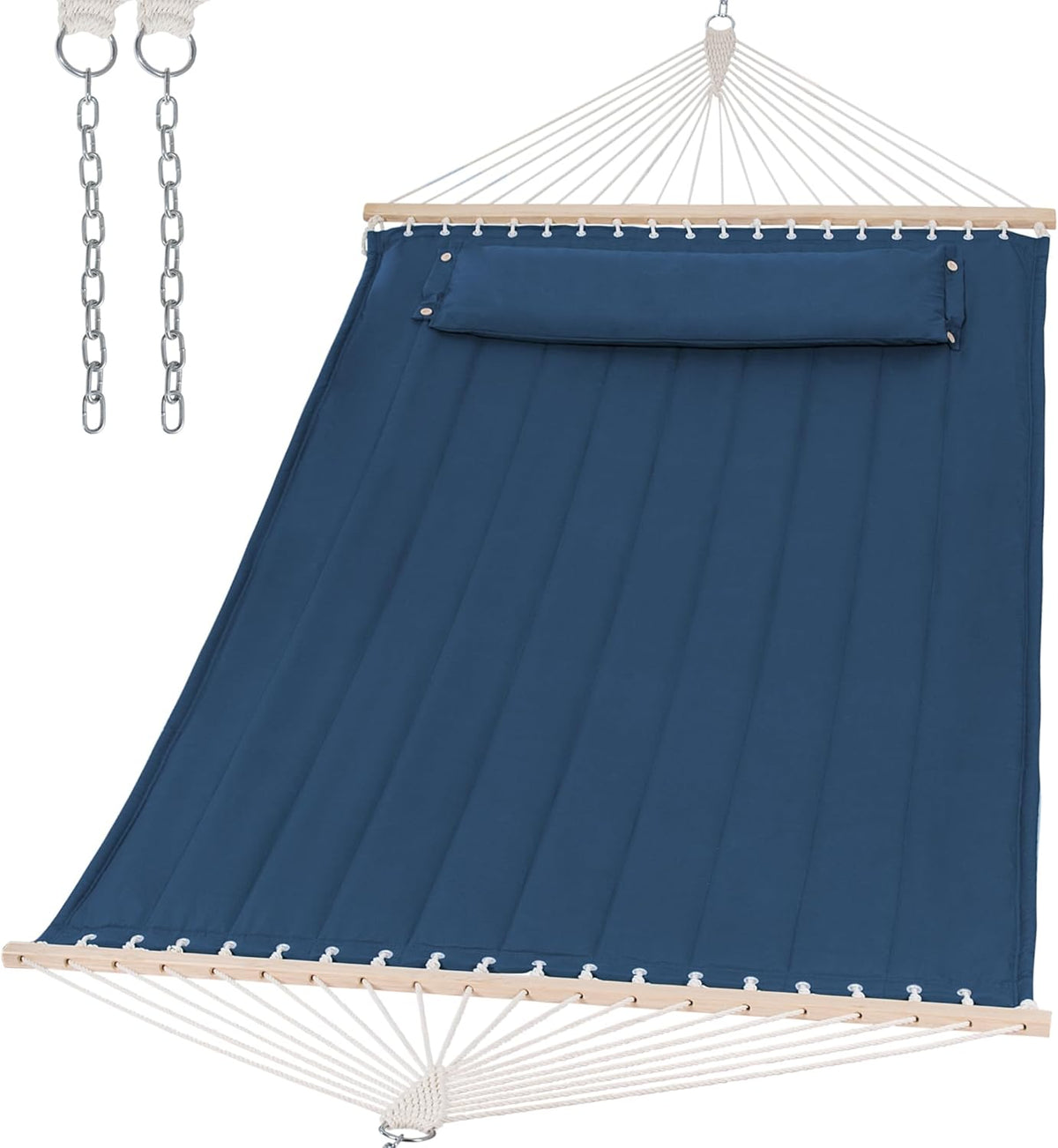 Angled view from the foot end of a deep navy quilted hammock showing stitched channels, wooden spreader bar, attached pillow