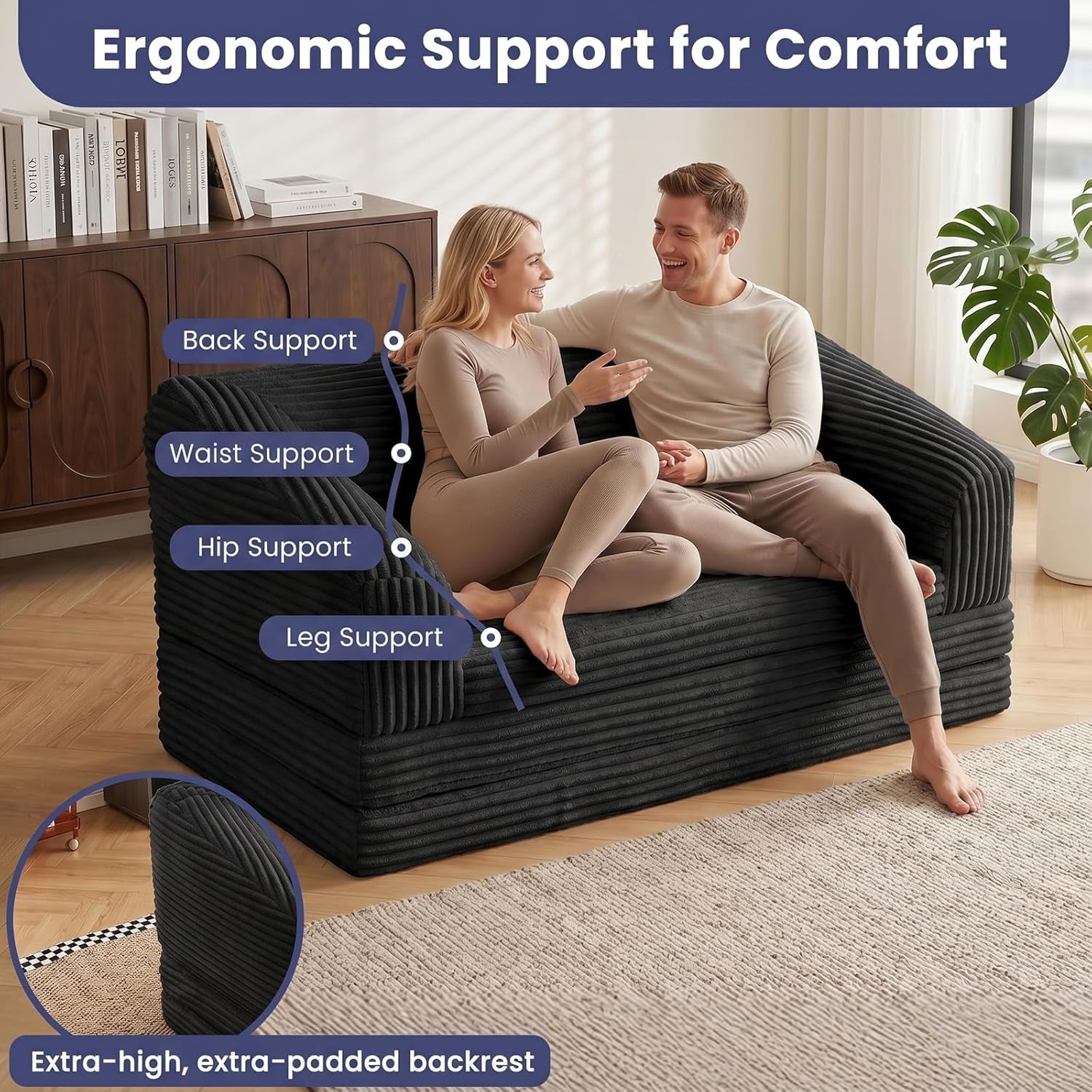 Two people seated on black corduroy loveseat demonstrating back, waist, hip and leg support