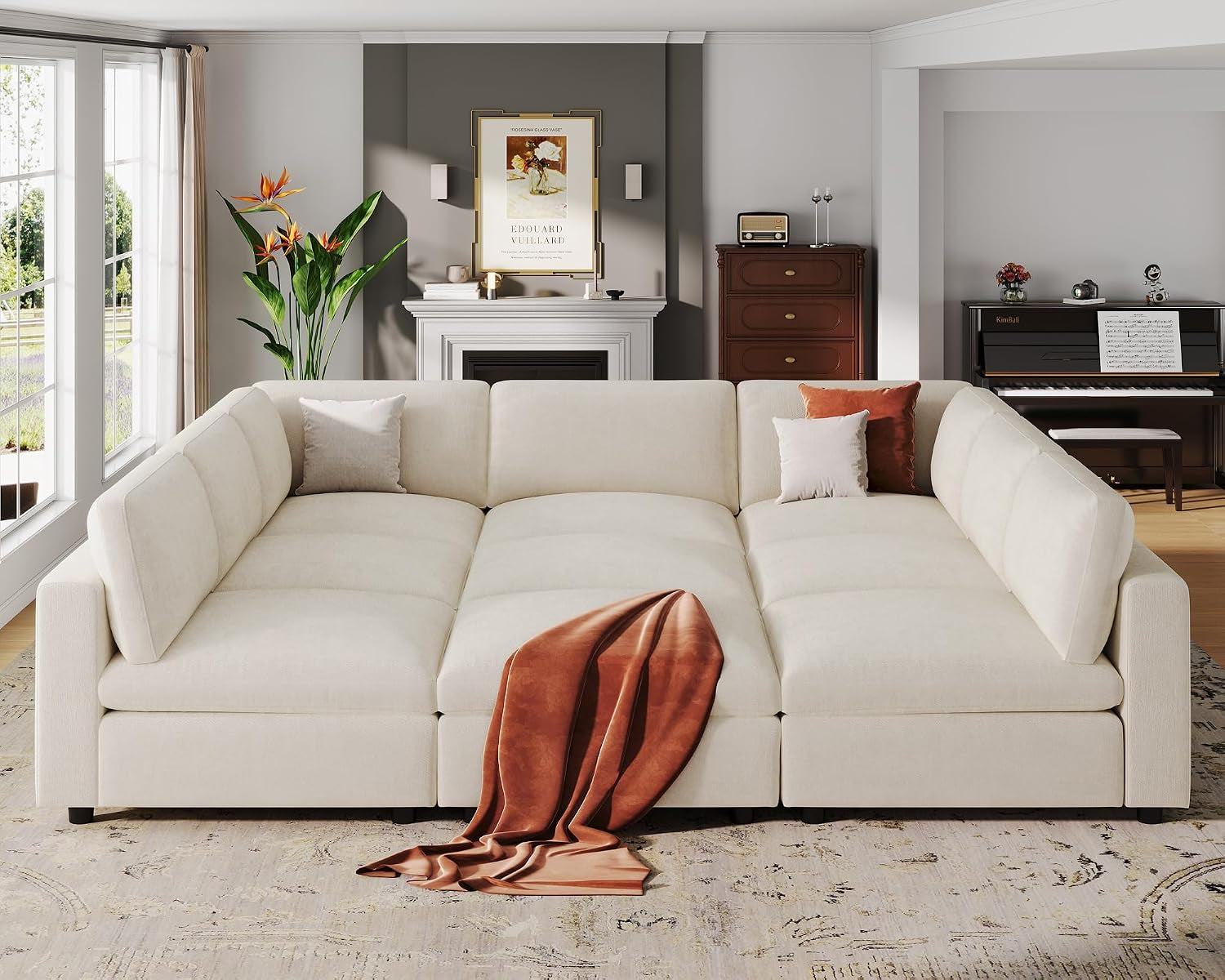 Slightly elevated view showing wide seat cushions and draped rust throw on sofa