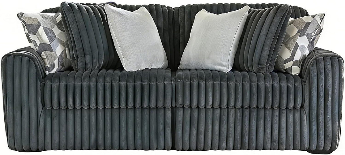 Front-facing view of a ribbed corduroy oversized lounge chair with three throw pillows on a white background.