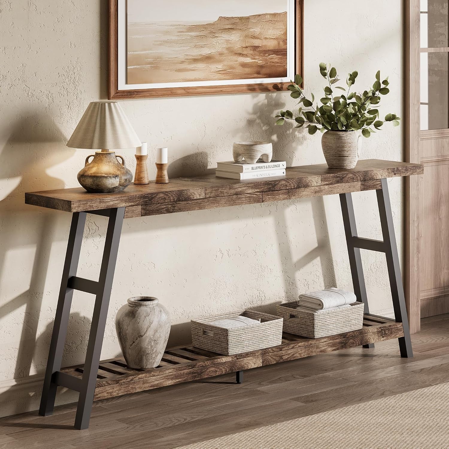 Console table with dark gray A-frame legs and rustic brown top, slatted shelf holding woven baskets