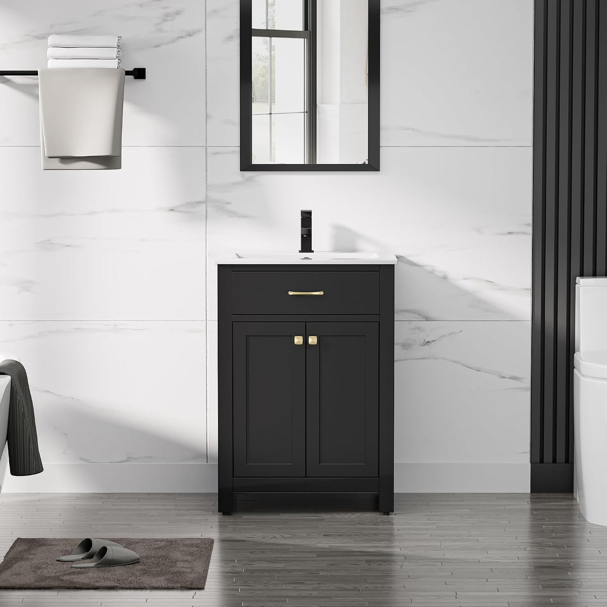 Narrow black single-sink vanity with white countertop, black faucet and gold knob hardware.