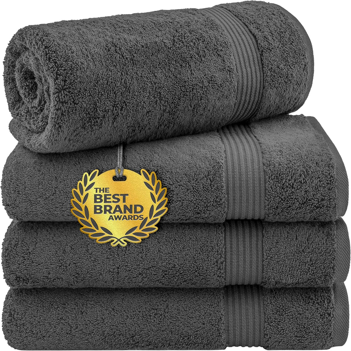 Stack of three dark gray towels with a rolled towel on top shown on a white background